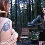 TS domme whipping a tranny in the forest