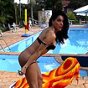 Beautiful shemale playing by the pool